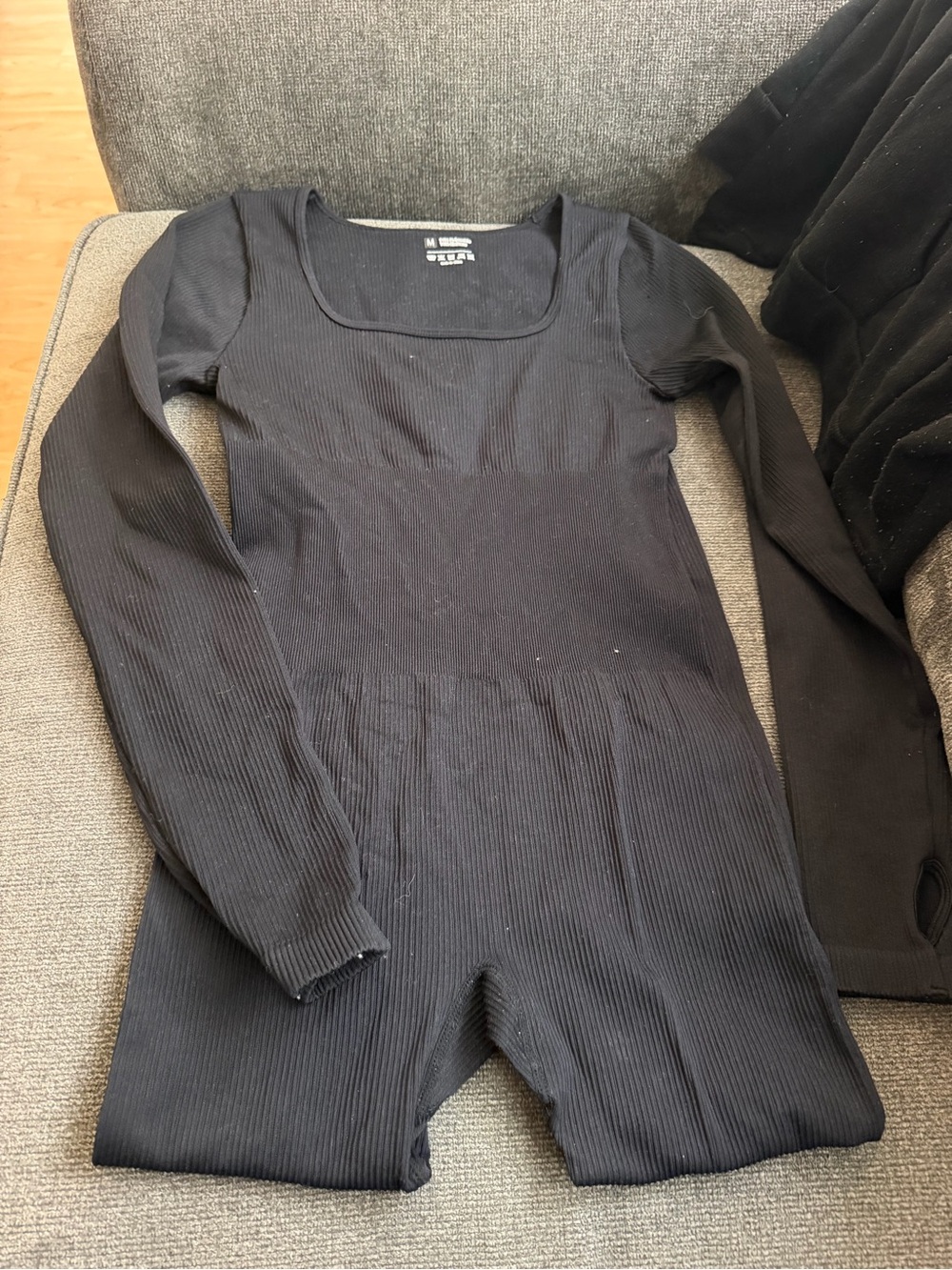 Black Ribbed Long-Sleeve One-Piece Bodysuit